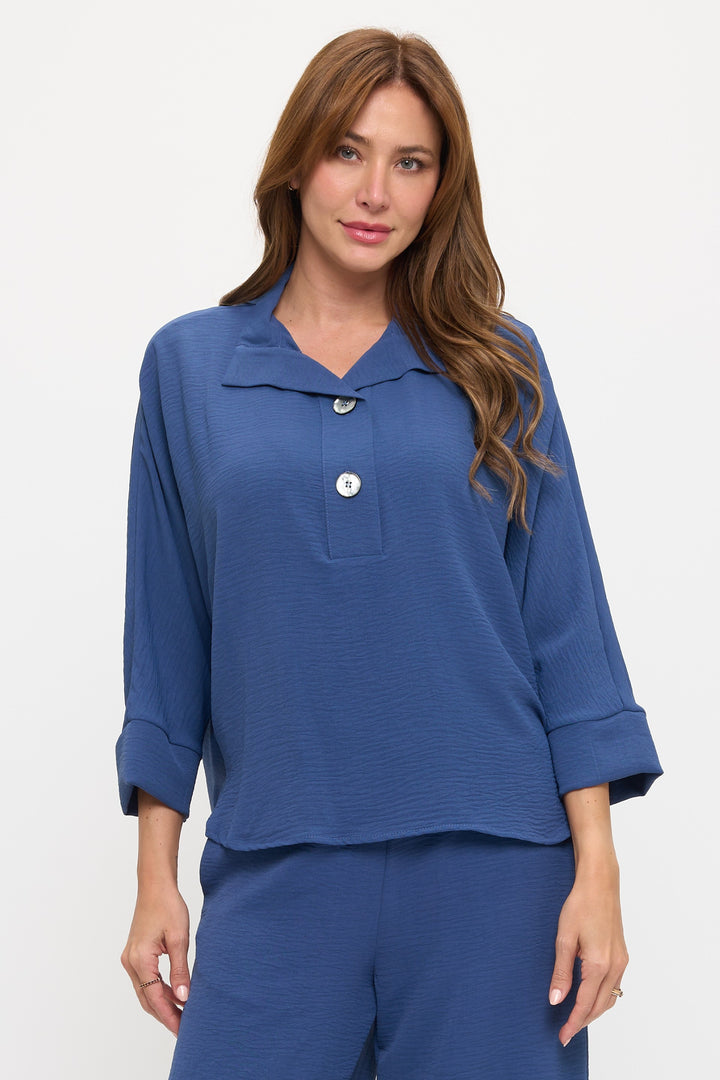 Woman wearing a blue outfit with a white background