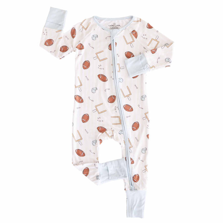 Baby onesie with sports-themed print on a white background