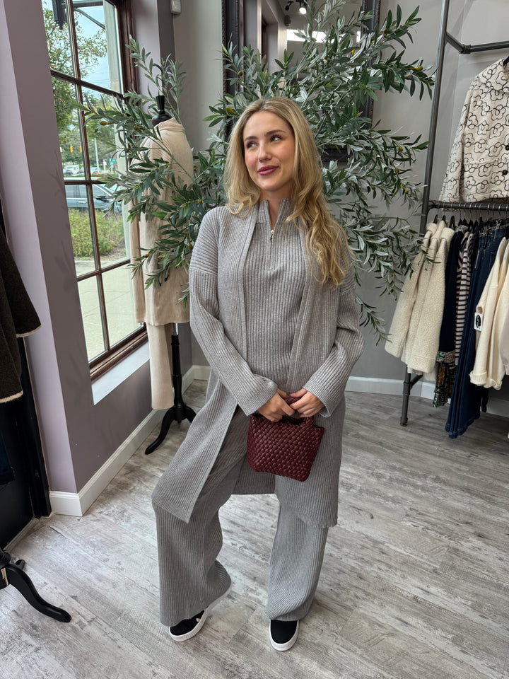St. Moritz Ribbed Open Cardigan in gray longline ribbed knit, front view with burgundy handbag