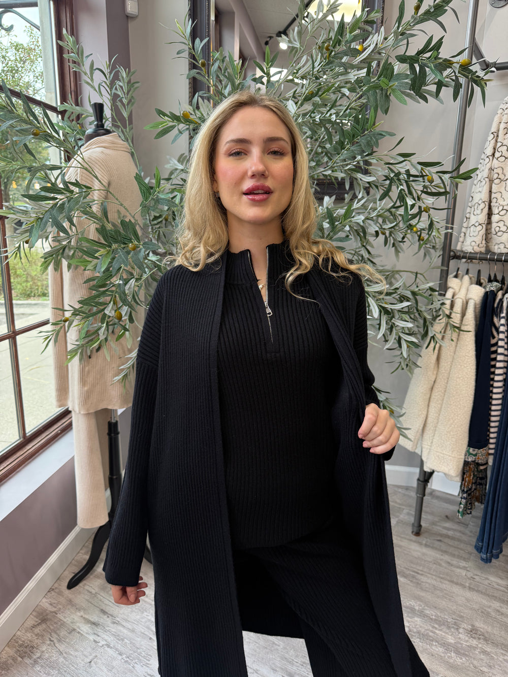 St. Moritz Ribbed Open Cardigan in black ribbed knit, waist-up front view