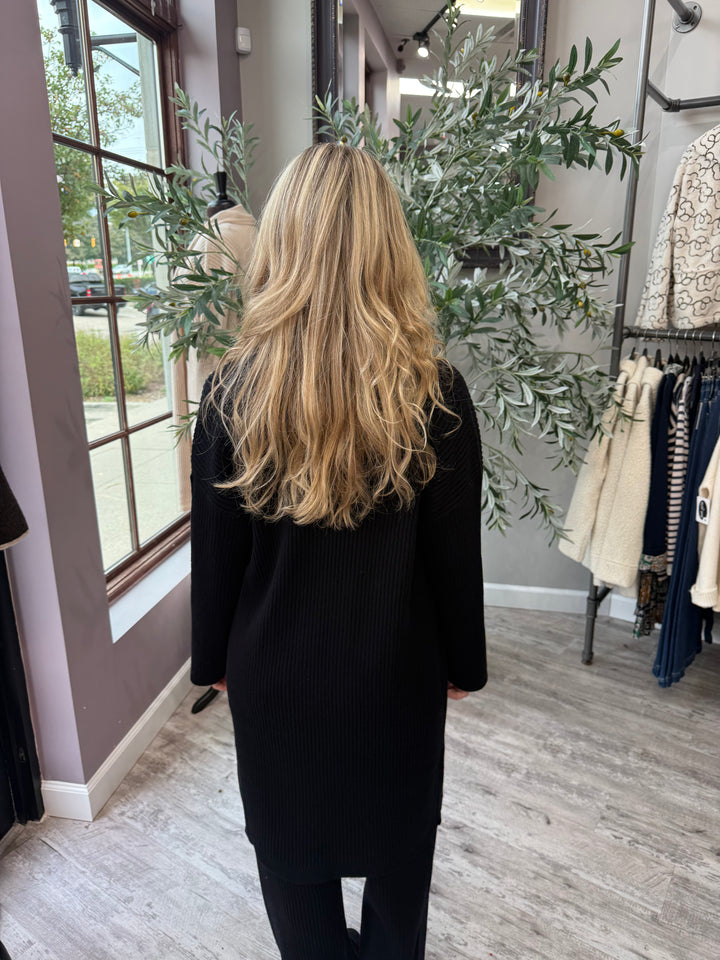 St. Moritz Ribbed Open Cardigan back view in black showing longline ribbed knit