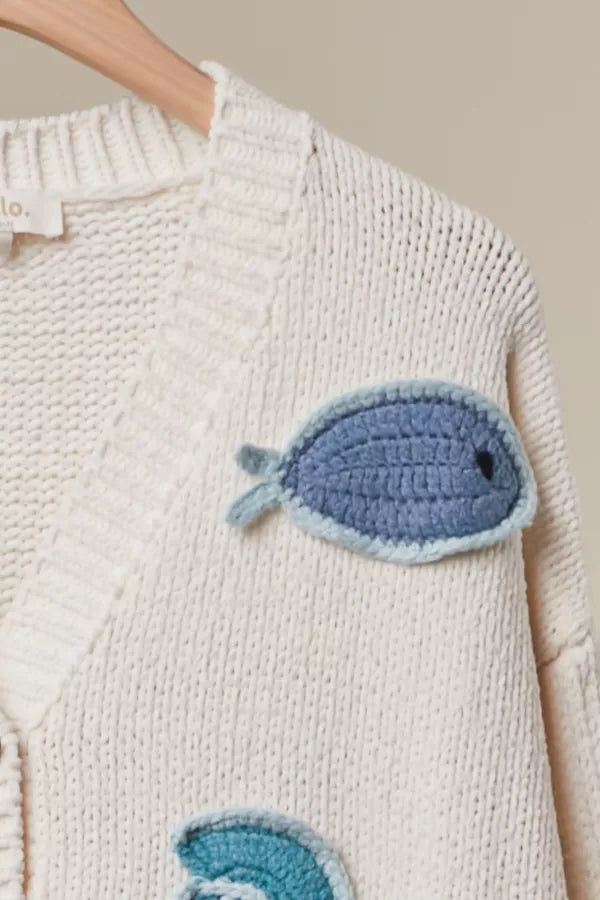 Tide Pool Cardigan close-up of crochet fish appliqué detail