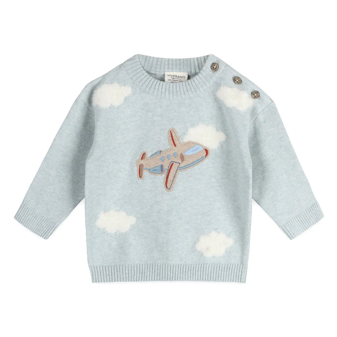 Light blue sweater with airplane and cloud design on a white background