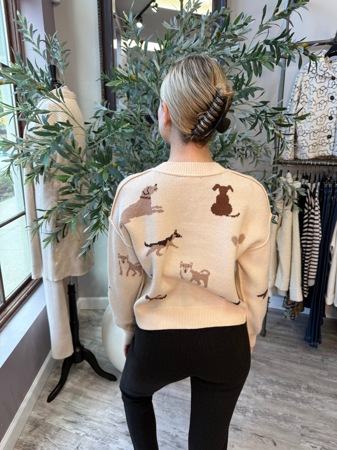 Best in Show Cardigan back view in cream showing brown and tan dog motifs