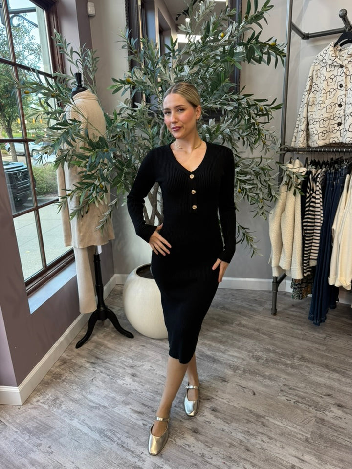 Rory Ribbed Sweater Dress in black V-neck midi with gold buttons, front view