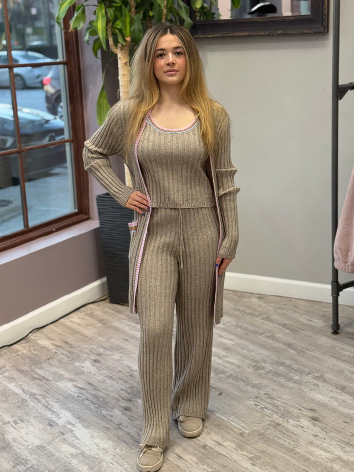 Women's ribbed lounge set in taupe, featuring a long cardigan with lavender trim, a cropped tank top, and matching wide-leg pants. Perfect for cozy, stylish relaxation.