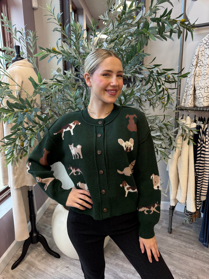 Best in Show Cardigan in pine green with dog motifs and wood buttons, front view