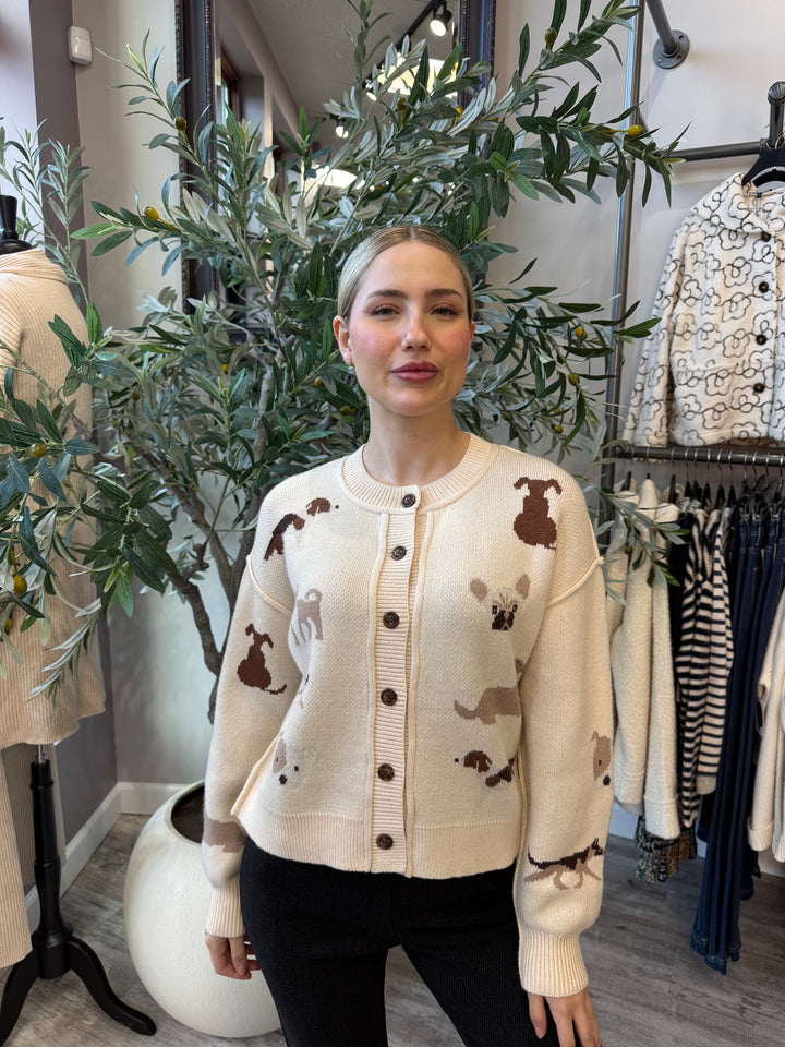 Best in Show Cardigan in cream with brown and tan dog motifs and button front, front view