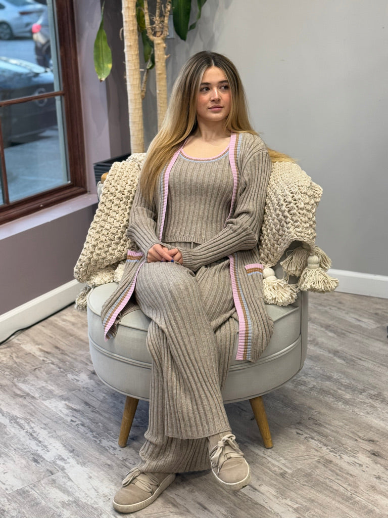 Women's ribbed lounge set in taupe, featuring a long cardigan with lavender trim, a cropped tank top, and matching wide-leg pants. Perfect for cozy, stylish relaxation.