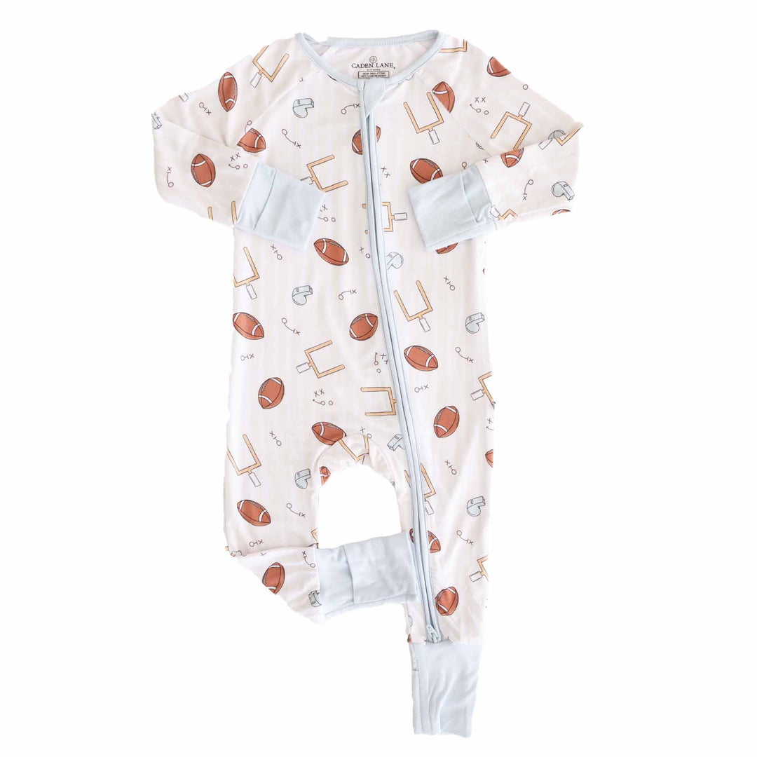 Baby onesie with sports-themed pattern on a white background