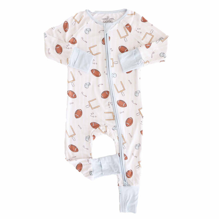 Baby onesie with sports-themed pattern on a white background