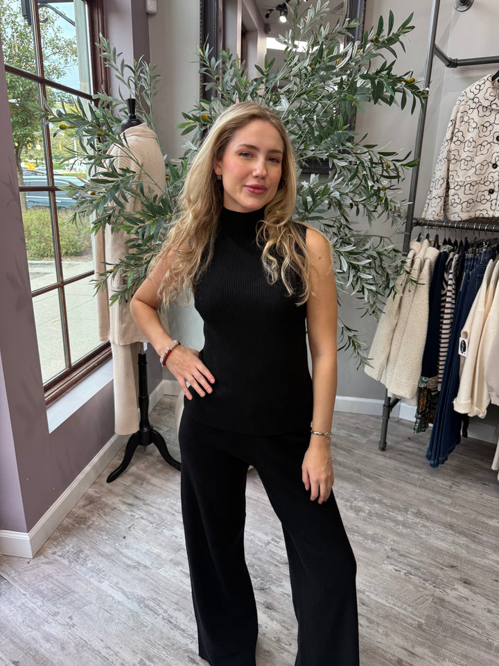 Rumi Ribbed Wide Leg Pant in black styled with sleeveless mock neck top, front view