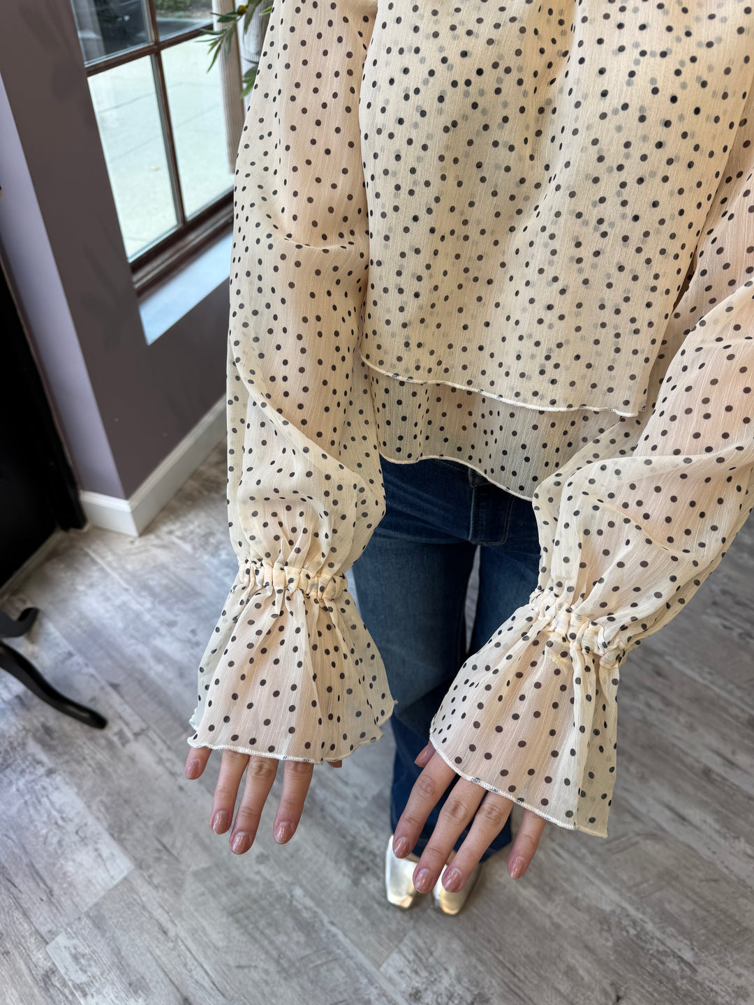 Juliette Polka Dot Blouse close-up of ruffled cuffs and sheer layered hem