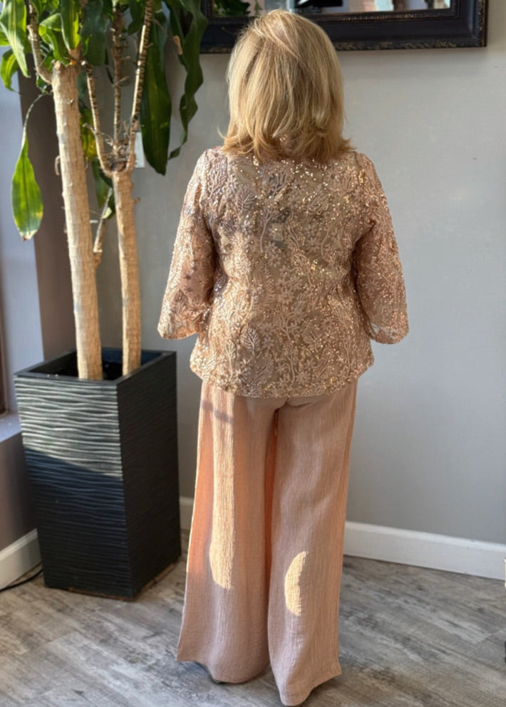 Lightweight wide leg rose gold colored dress pants with crinkle texture.