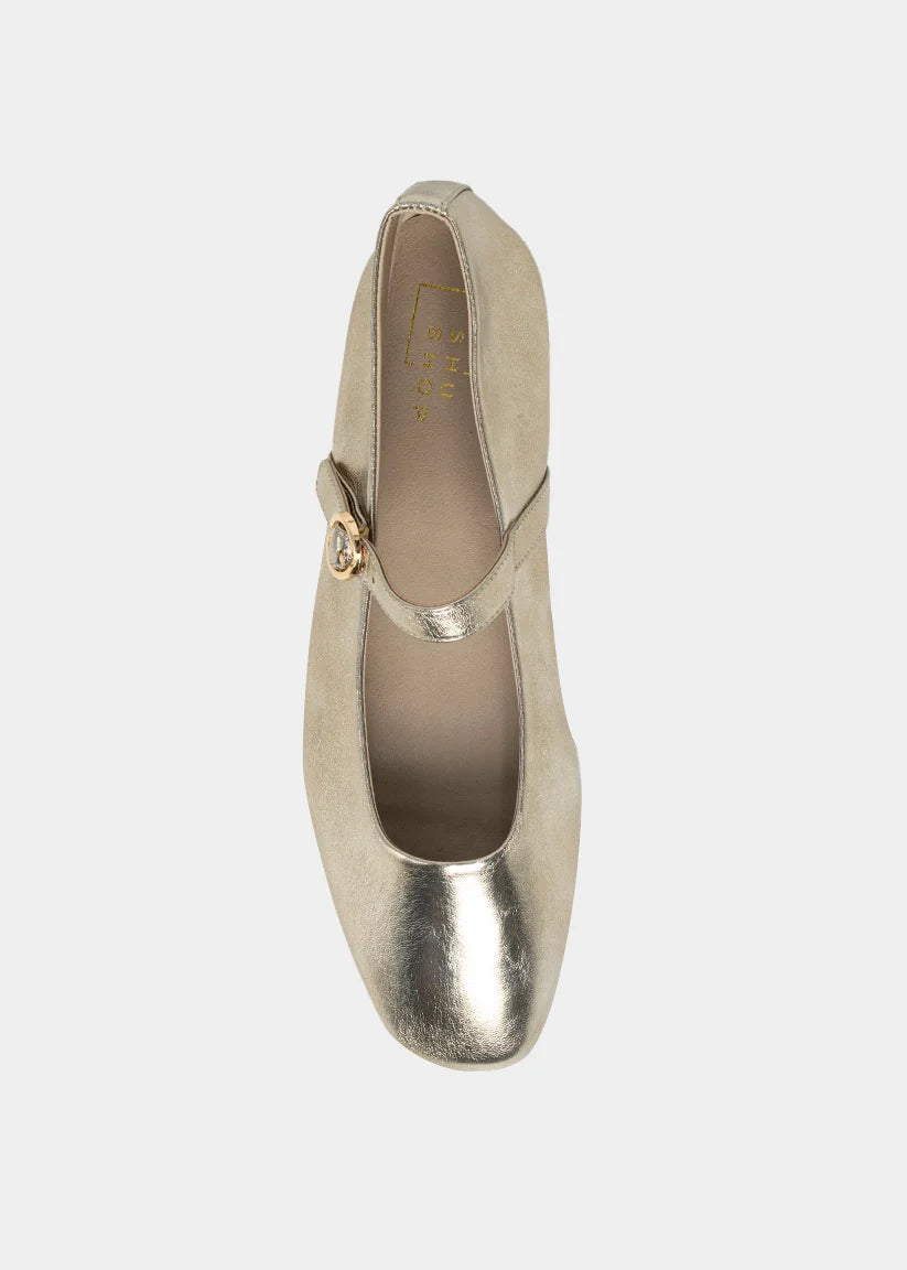 Gold high-heeled shoe on a white background