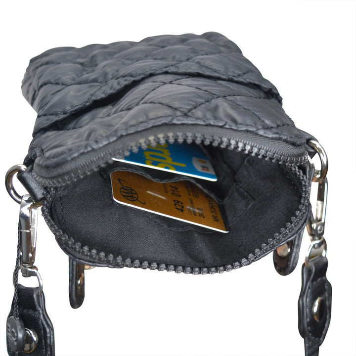 Gray quilted handbag with a zipper open, showing credit cards inside on a white background