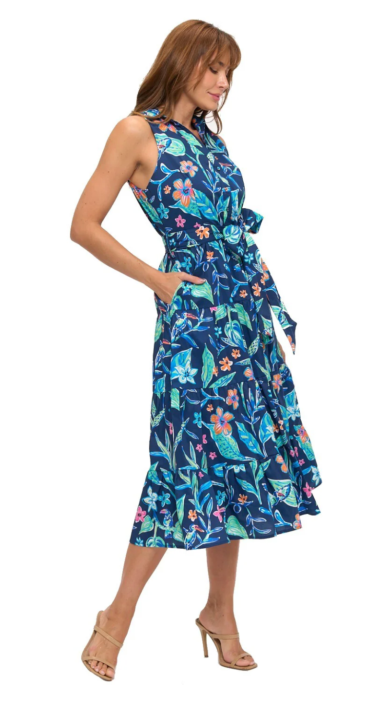 Woman wearing a blue floral dress on a white background