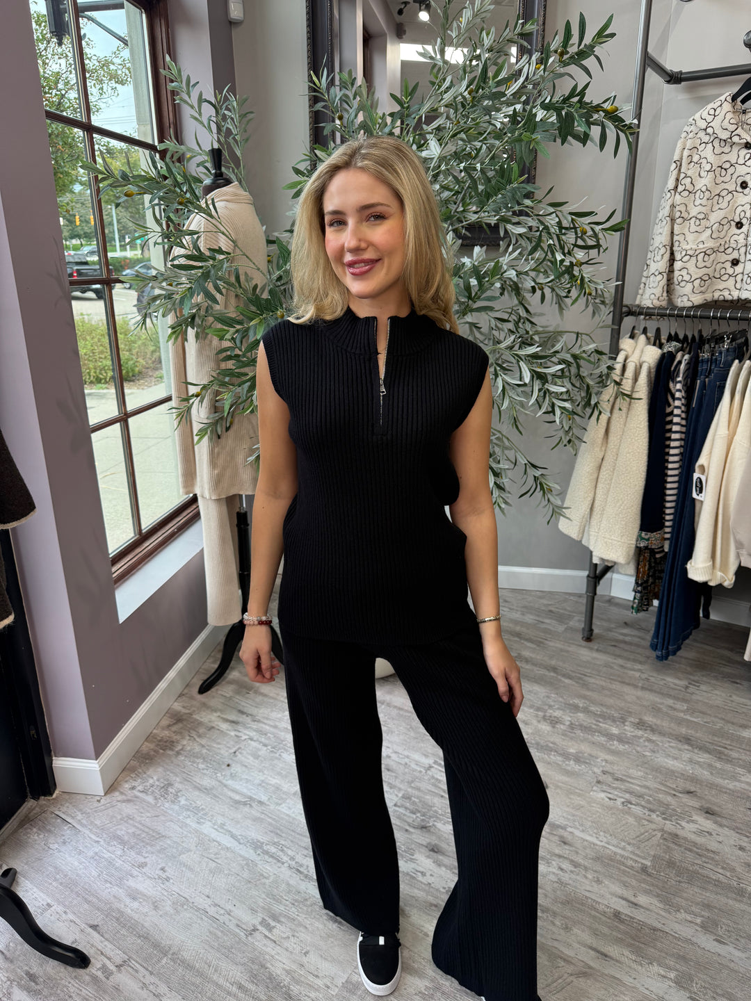St. Moritz Ribbed Knit Pant in black wide leg, styled with matching zip mock neck tank, front view