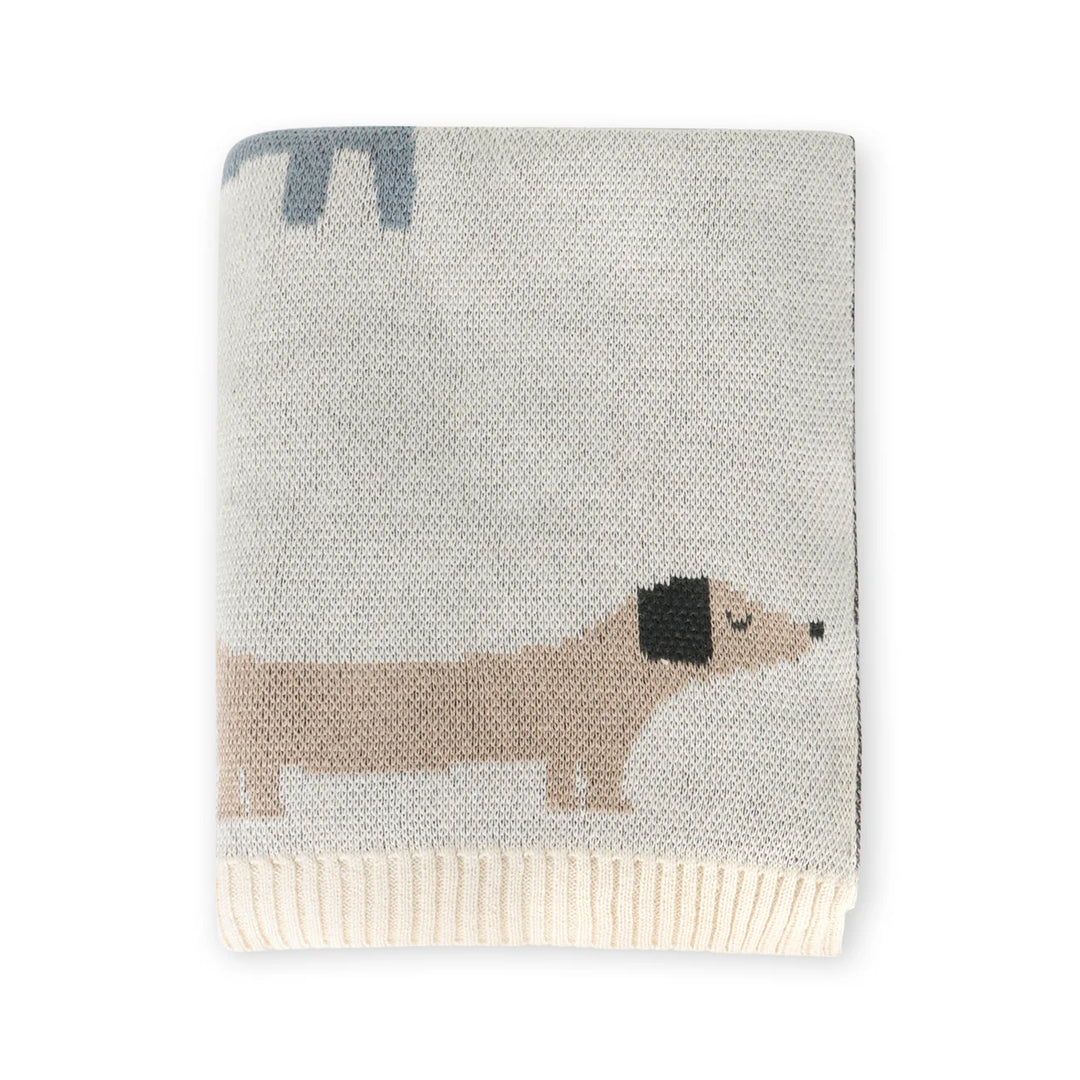Knitted blanket with a dachshund design on a white background