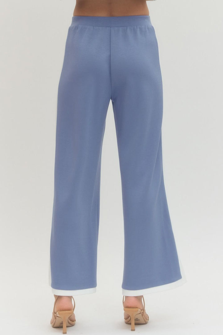 Light blue pants on a plain background