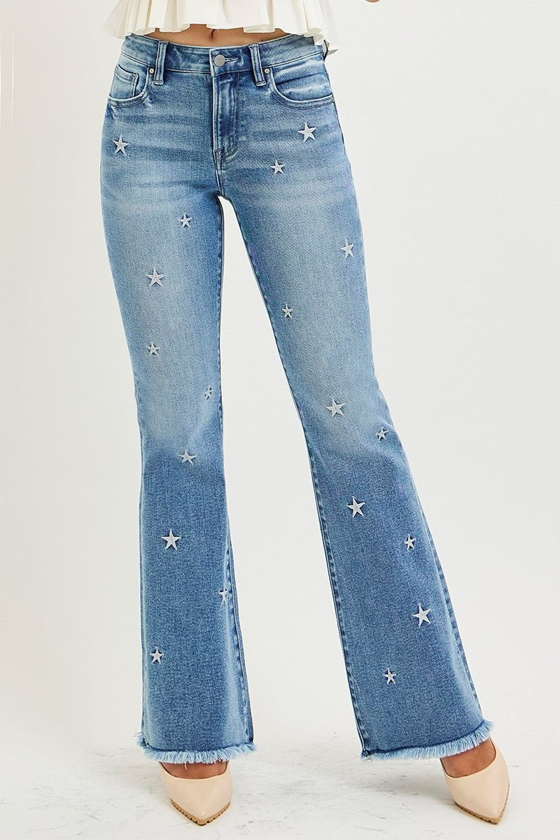 Blue jeans with star patterns on a white background