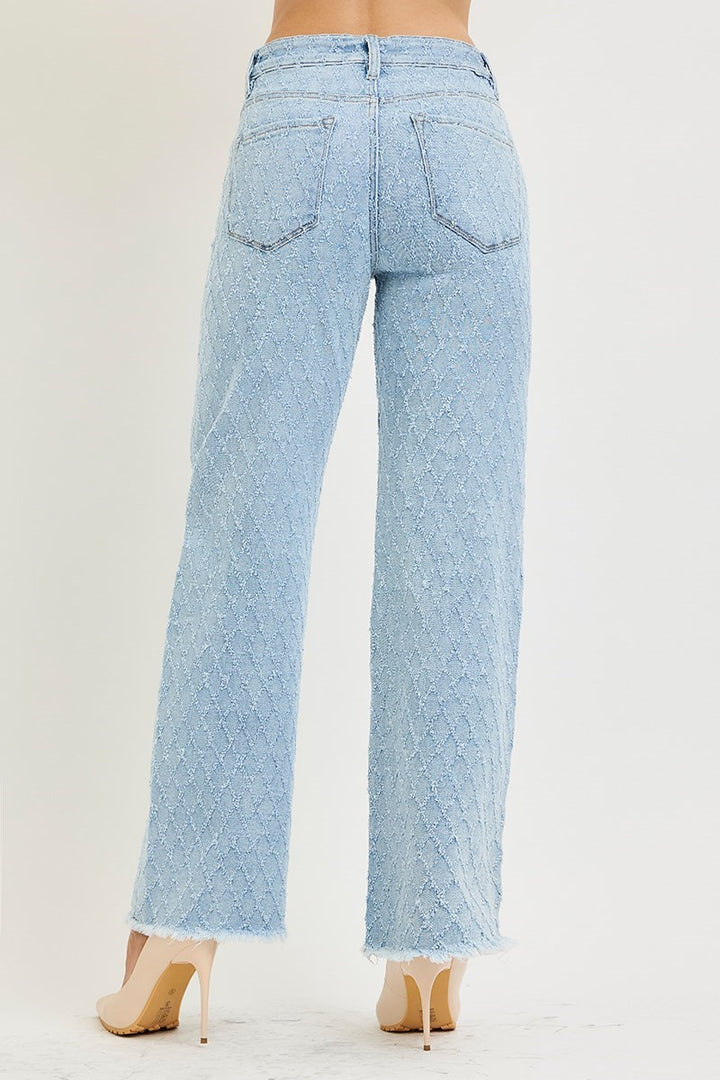 Light blue jeans worn by a person on a white background
