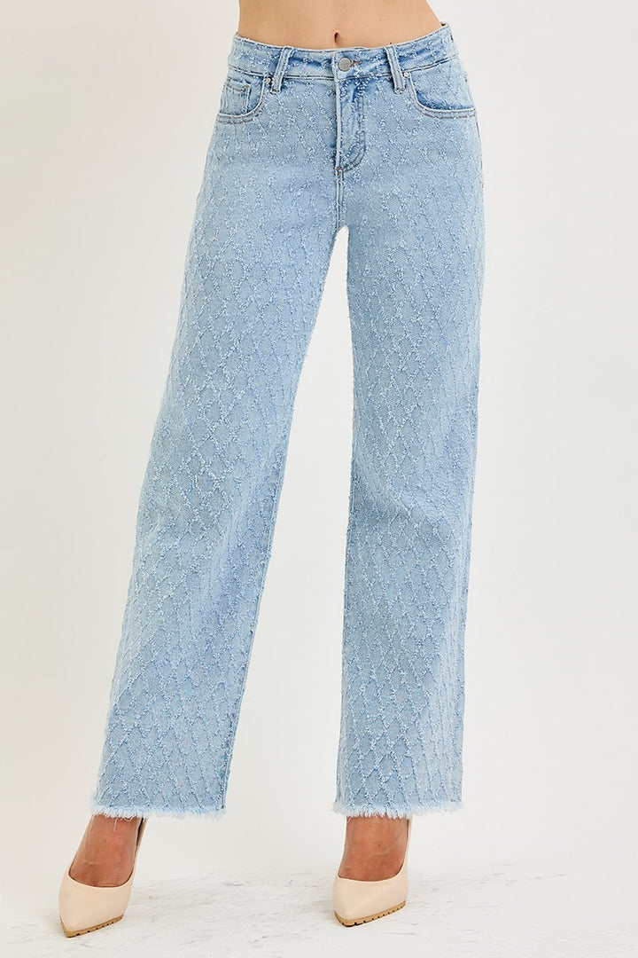Light blue jeans worn by a person on a white background