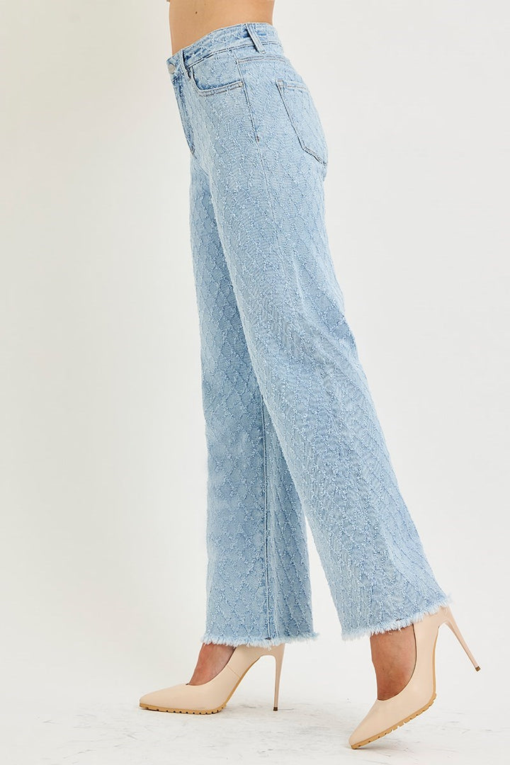 Light blue jeans worn by a person on a white background
