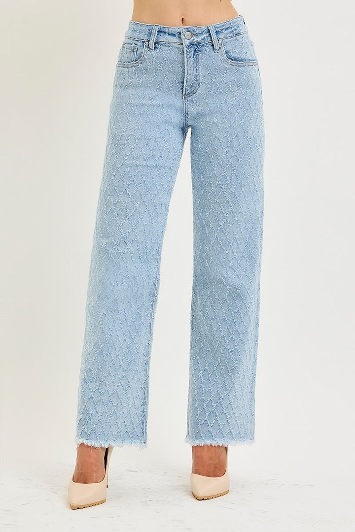 Light blue jeans worn by a person on a white background