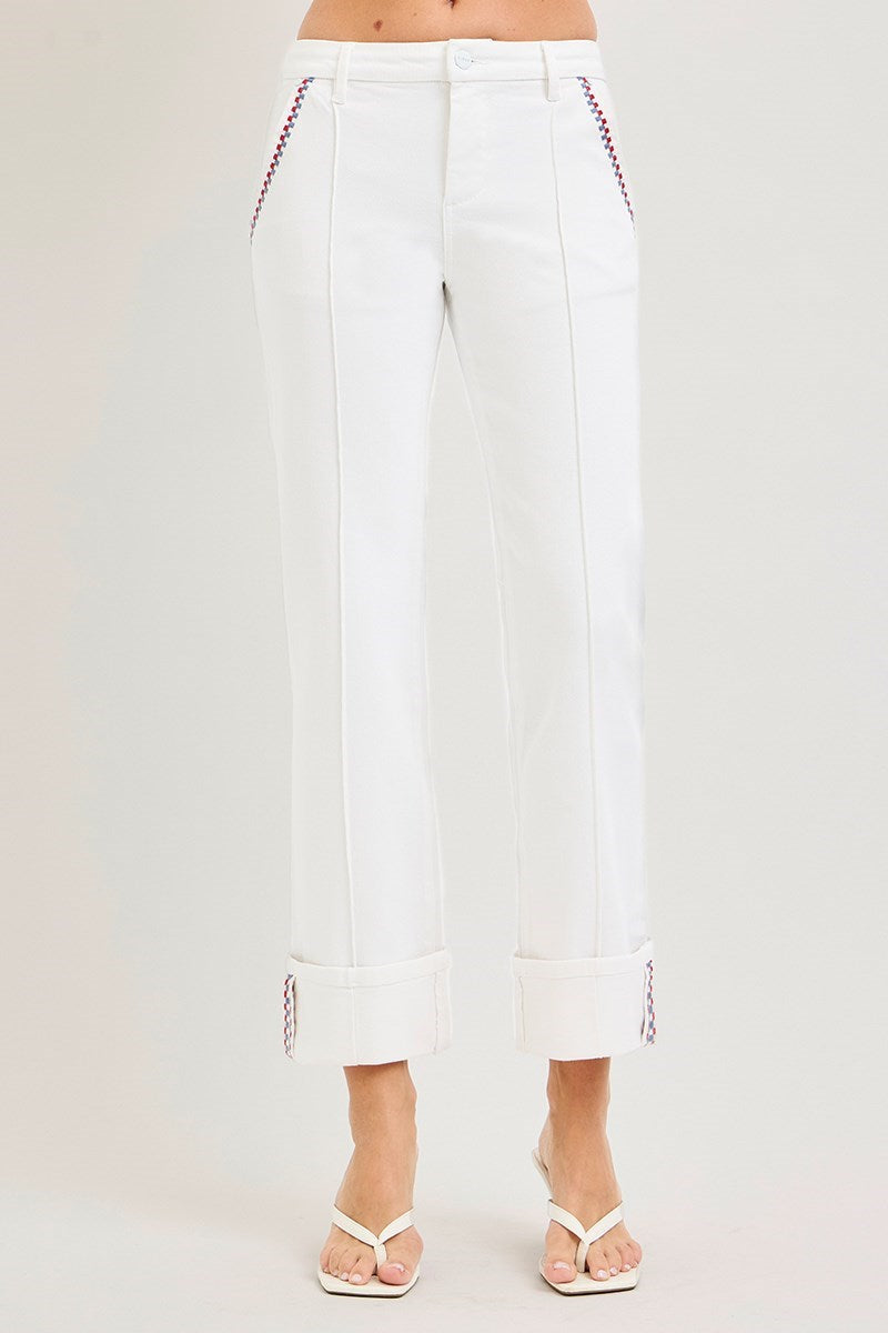 White pants with red stitching on a white background