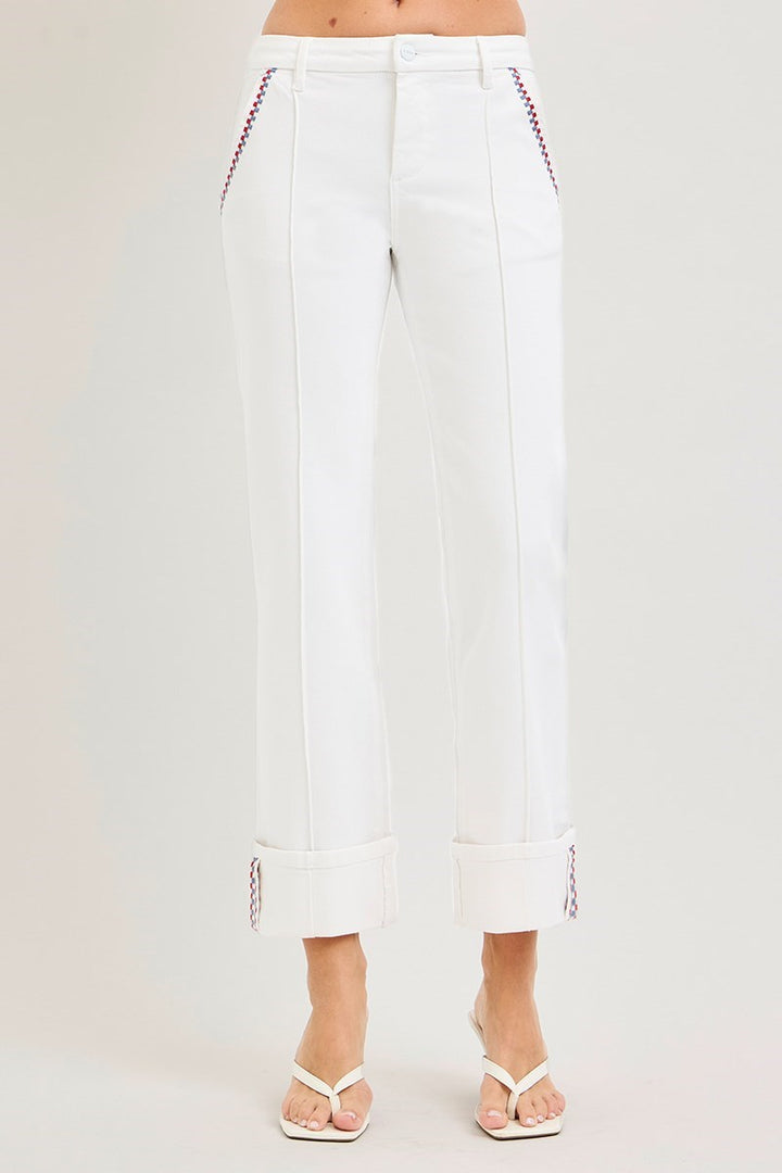 White pants with red stitching on a white background