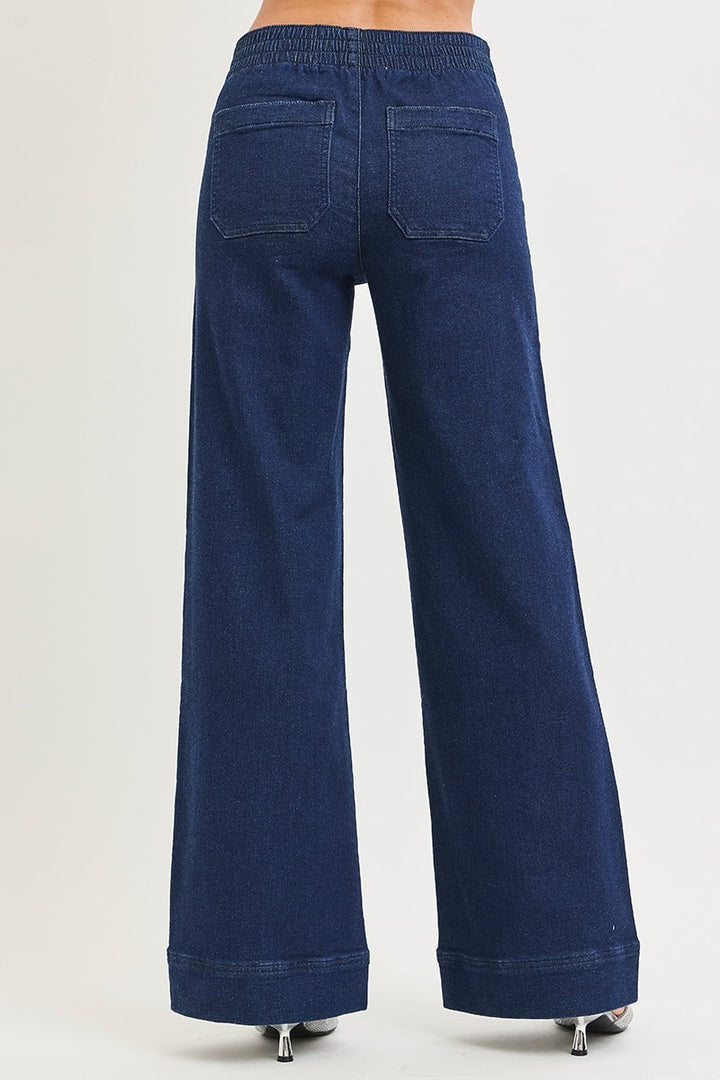 Blue wide-leg jeans on a white background