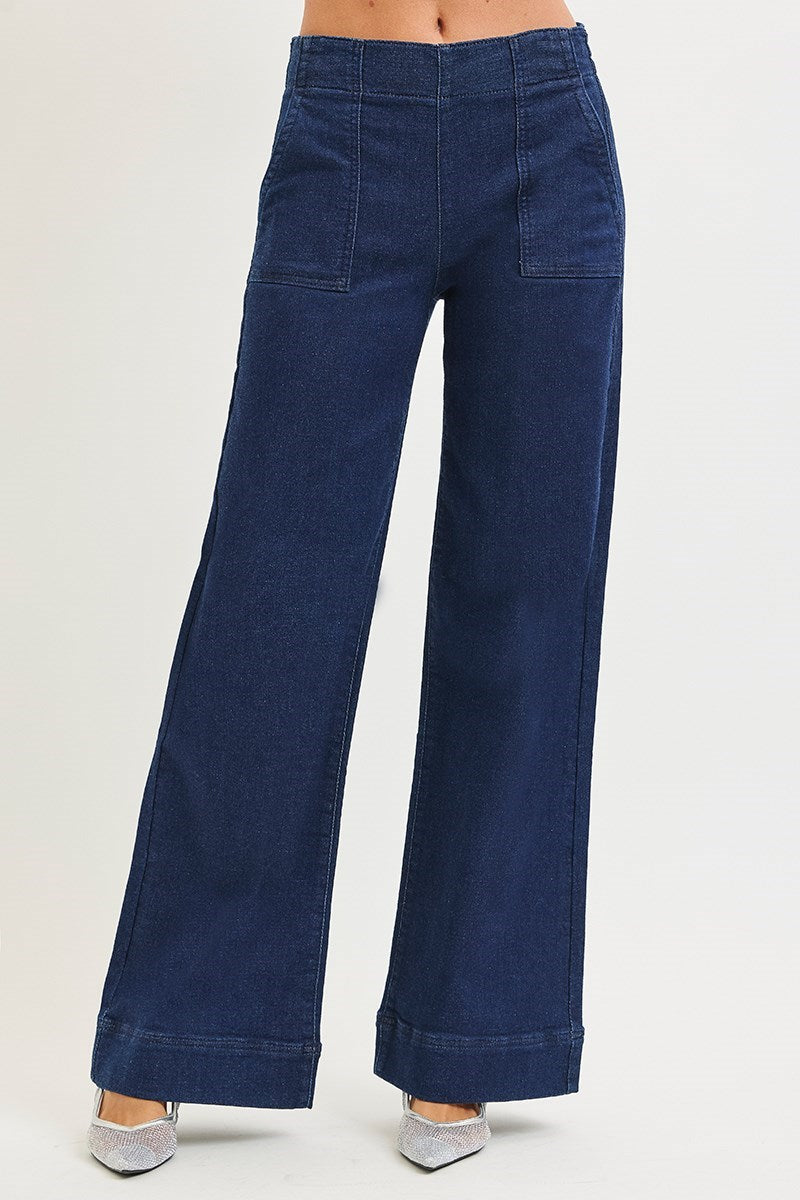 Blue wide-leg jeans on a plain background