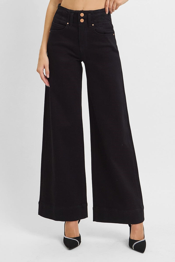 Black wide-leg pants worn by a person on a white background