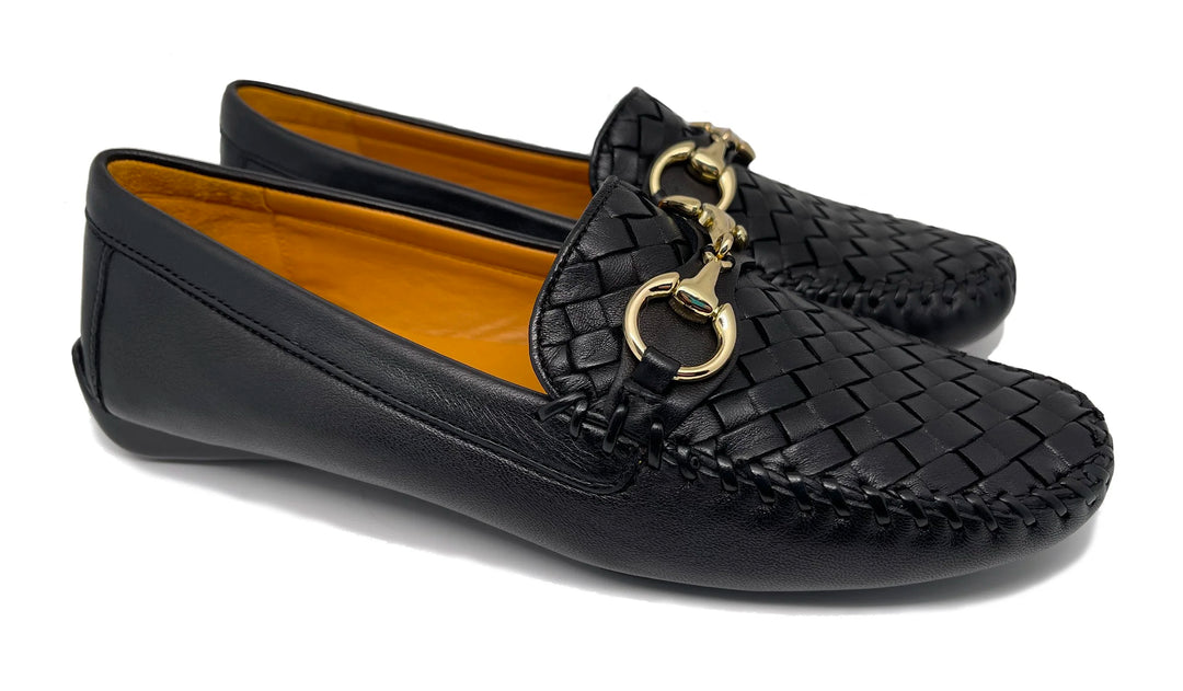 Black woven loafers with gold accents on a white background