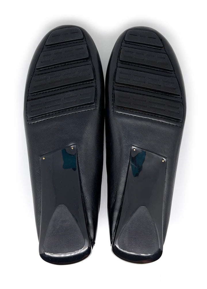 Pair of black diving fins on a white background