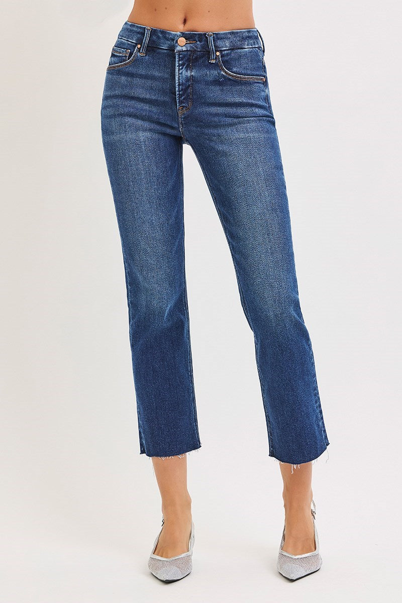 Blue jeans worn by a person on a white background