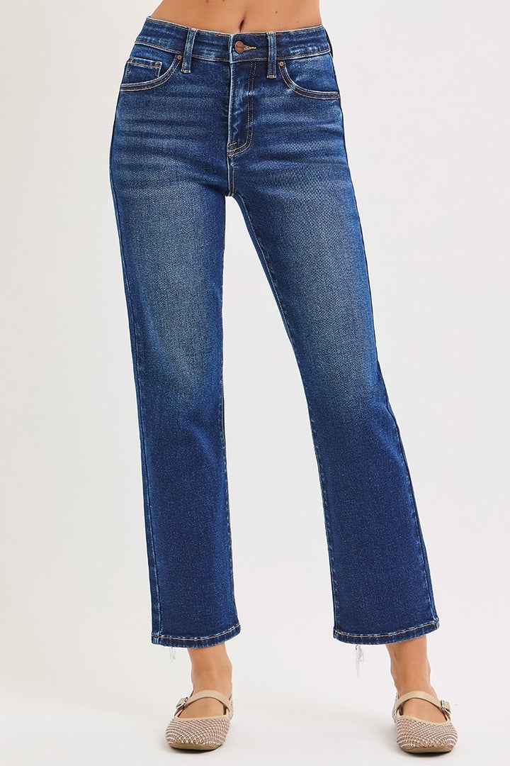 Blue jeans worn by a person on a white background