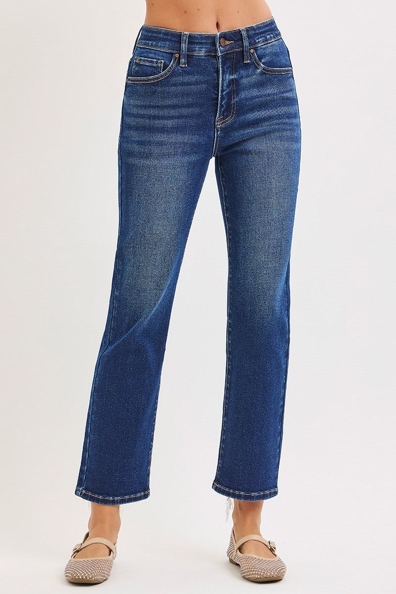 Blue jeans worn by a person on a white background