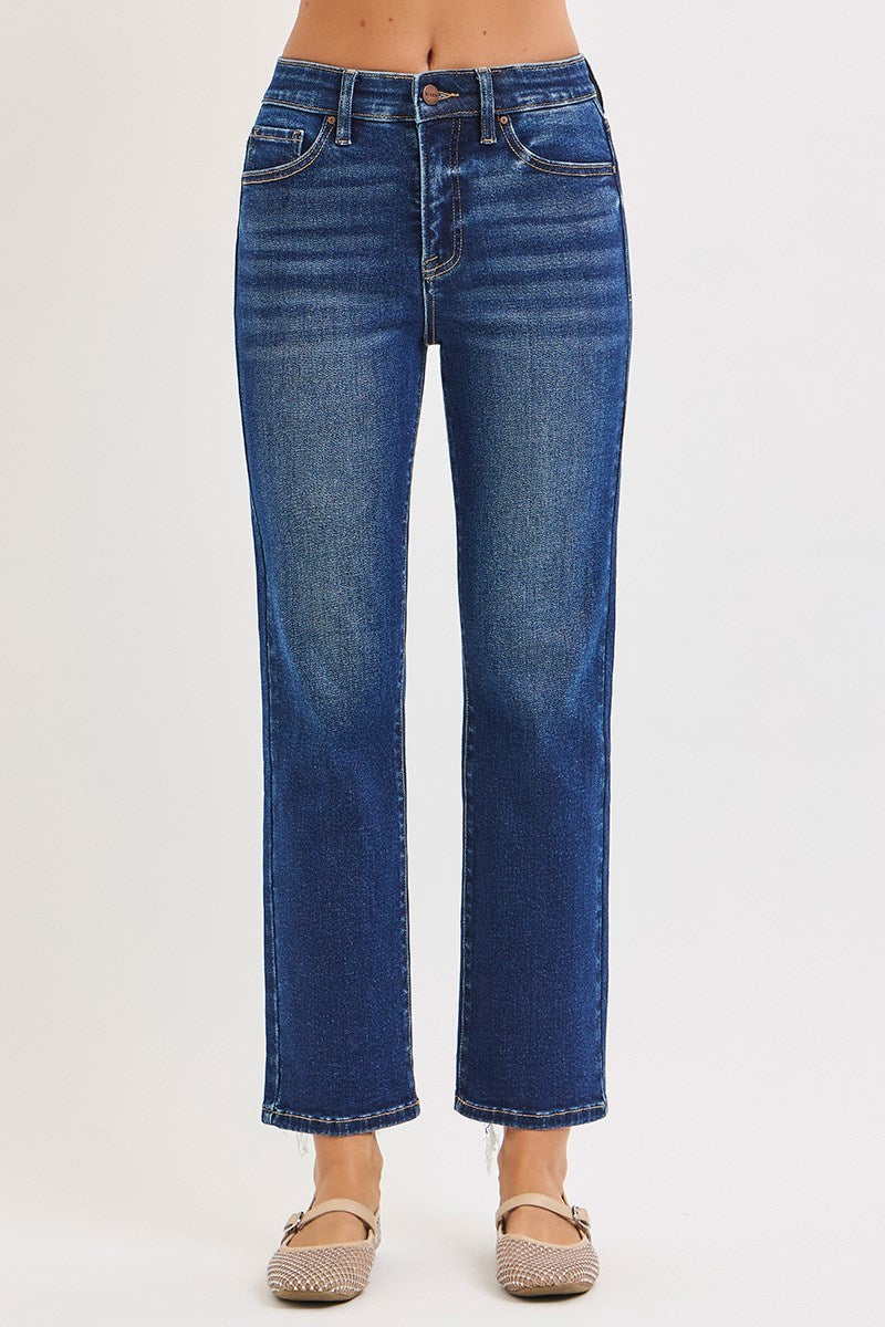 Blue jeans worn by a person on a white background