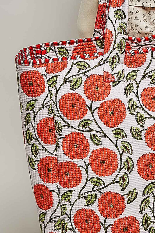 Tote bag with red floral pattern on a white background