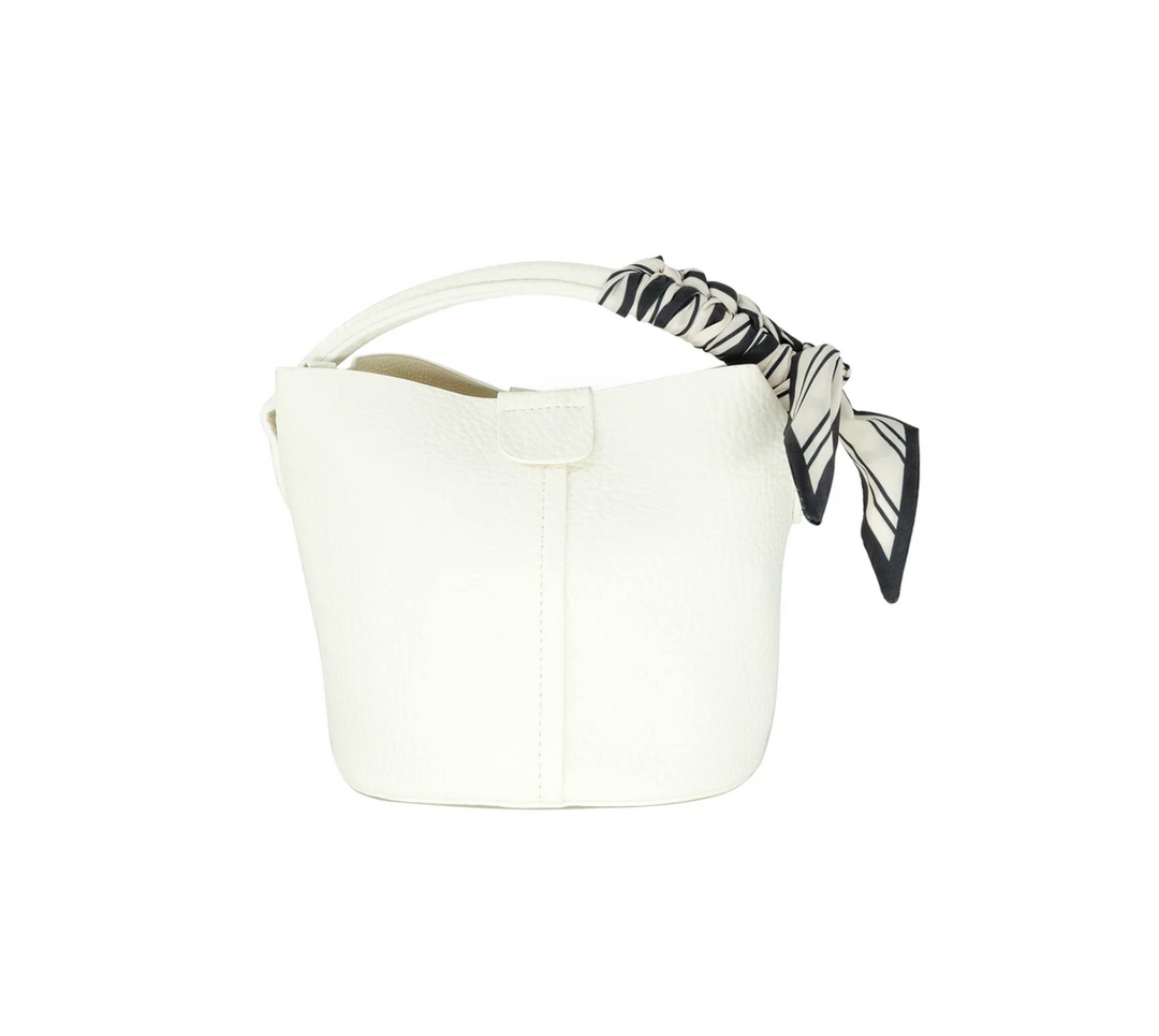 White bucket bag with a black and white striped handle on a white background