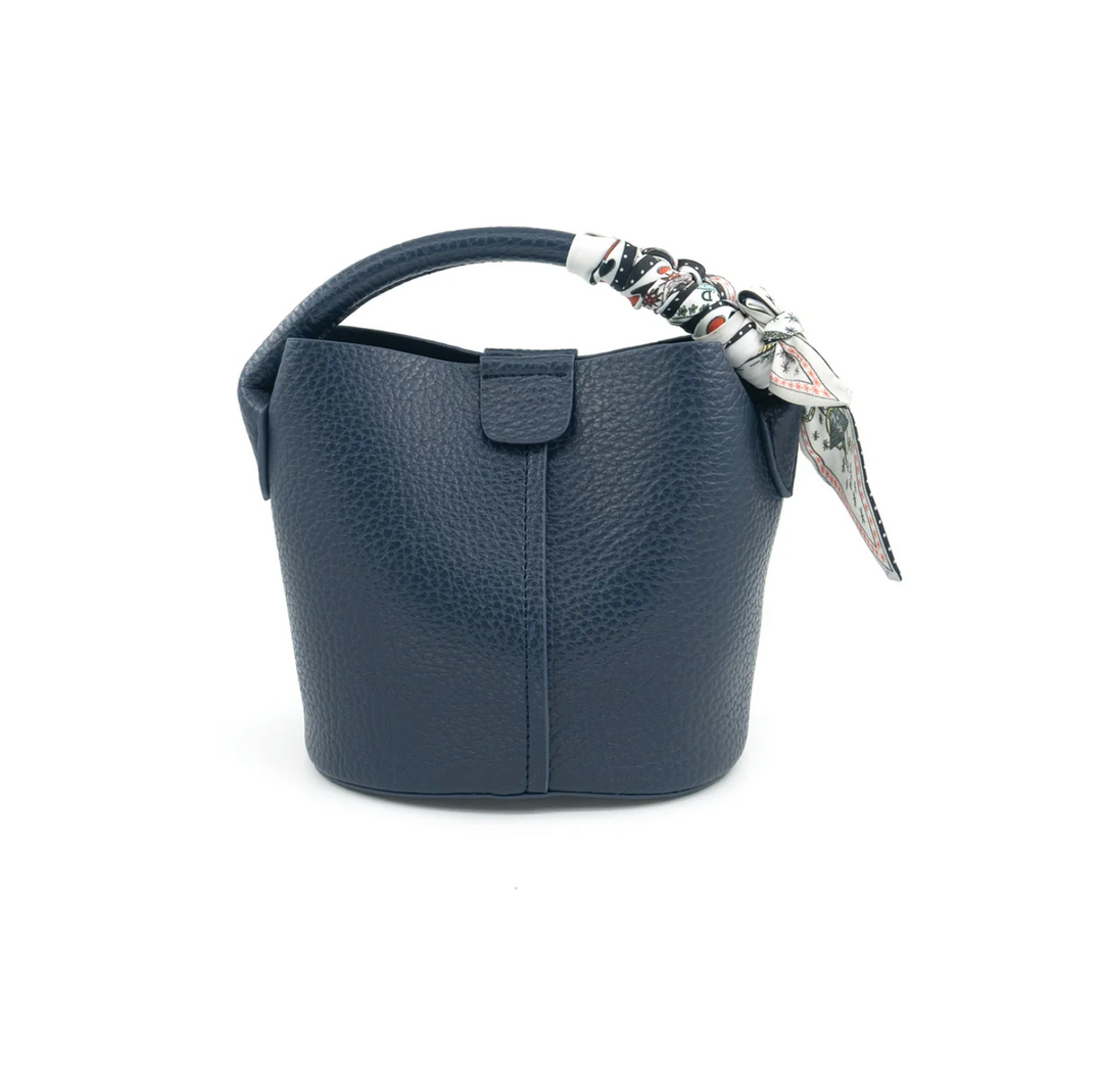 Navy blue handbag with a decorative strap on a white background
