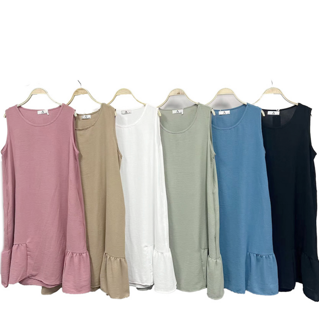 Six sleeveless dresses in different colors hanging on a rack.