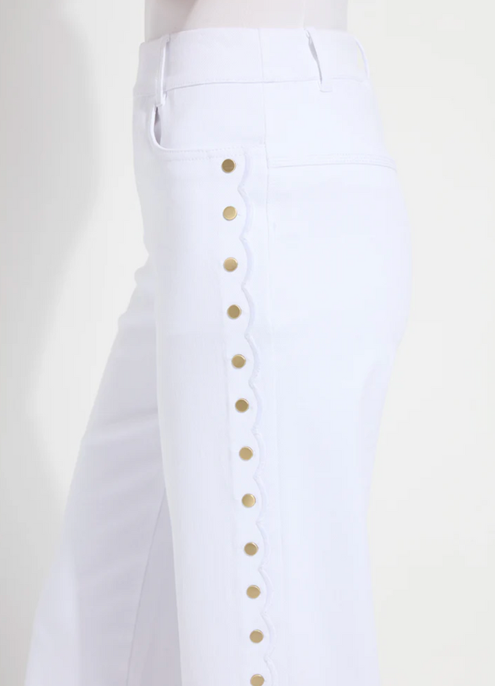 White pants with gold buttons on a white background