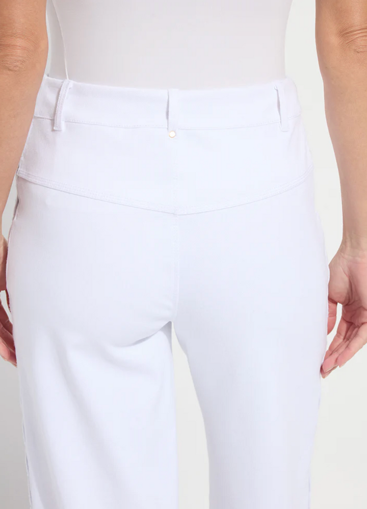 White pants worn by a person on a light background