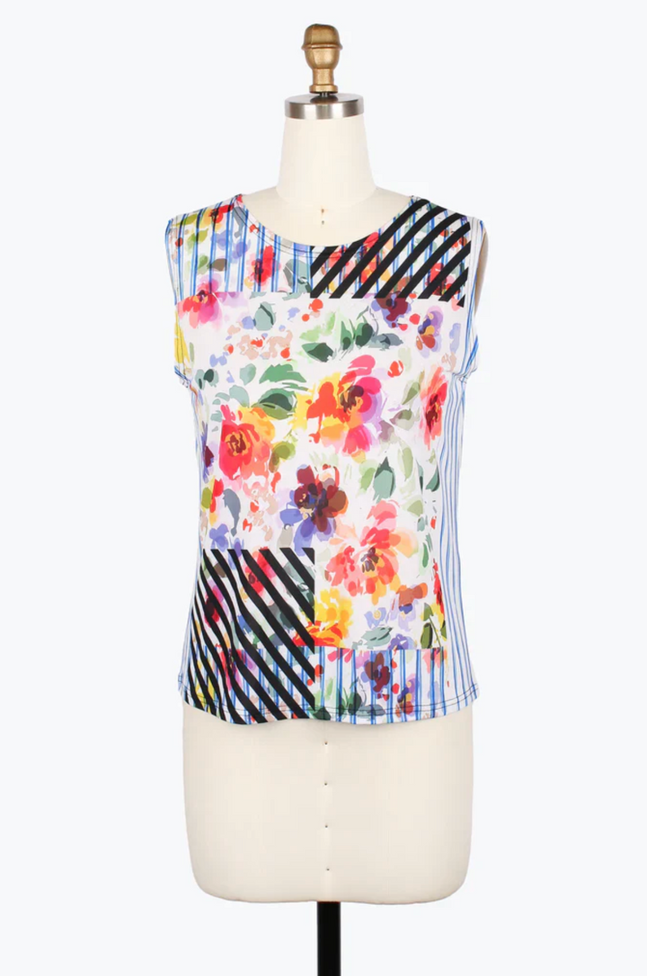 Colorful floral and striped sleeveless top on a mannequin against a white background