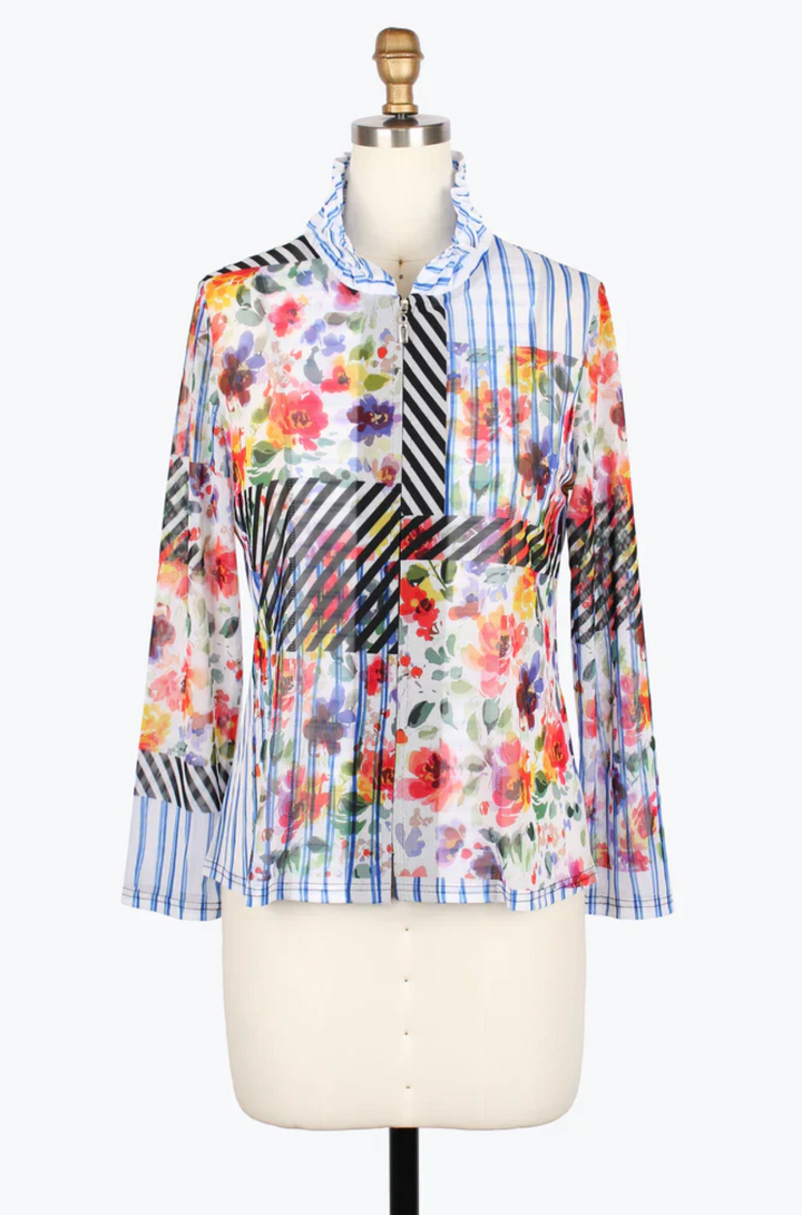 Colorful floral and striped shirt on a mannequin against a white background