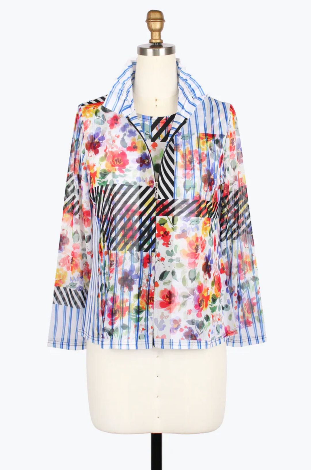 Colorful patchwork blouse on a mannequin with a white background