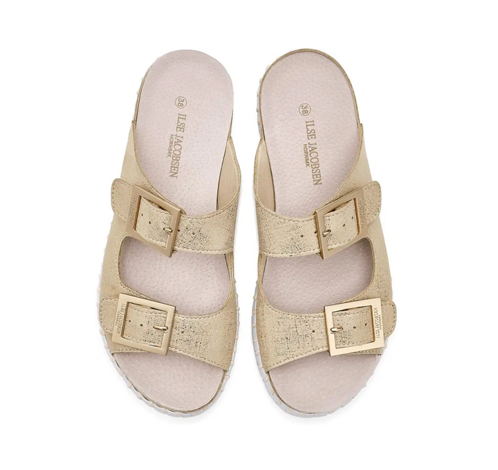 Beige sandals with buckles on a white background